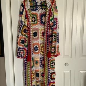 Long, patchwork knitted cardigan with hood.